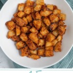 Pinterest pin with text overlay 'Air Fryer Croutons', image of golden brown crunchy croutons in a bowl.
