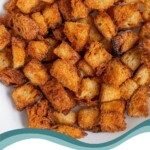 Pinterest pin with text overlay 'Air Fryer Croutons', image of golden brown crunchy croutons in a bowl.