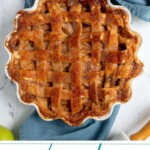 Pinterest Pin with text overlay 'Homemade Apple Pie', image of a pie on a blue towel next to some forks.