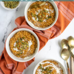 Pinterest Pin with text 'Instant Pot Pumpkin Steel Cut Oats', image of a white bowl with pumpkin oatmeal and garnished with cream and pumpkin seeds.