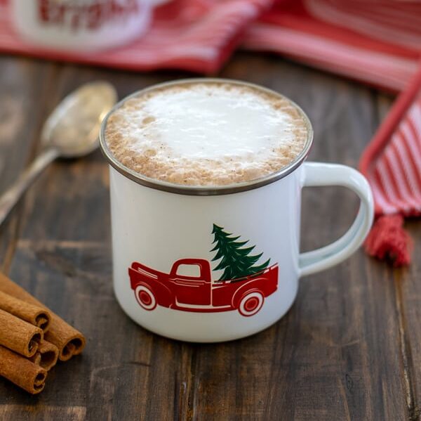 a skinny gingerbread tea latte with foam in a white mug on a table