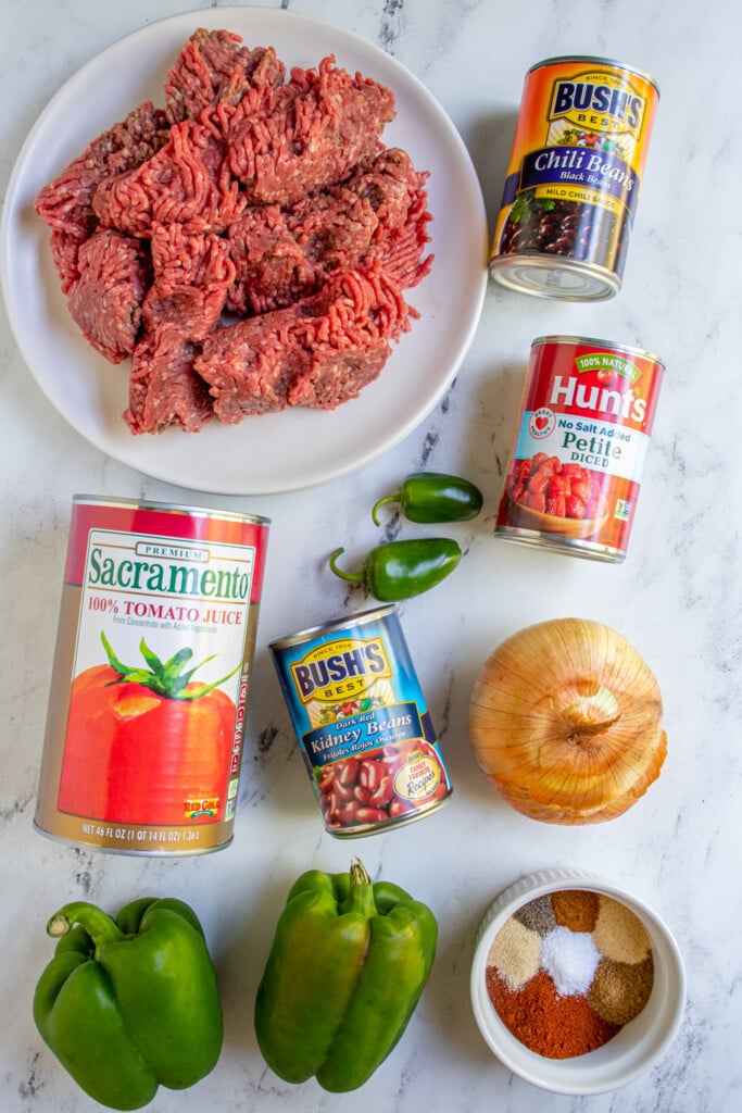 Ingredients needed to make classic crockpot chili laid out on a table top.