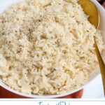 Pinterest Pin with text "Instant Pot Risotto", image of bowl of risotto and serving spoon.