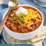 Pinterest pin with text 'Crockpot Classic Chili', image of white bowl with chili and garnishes.