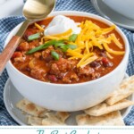 Pinterest pin with text 'the best Crockpot Classic Chili', image of white bowl with chili and garnishes.