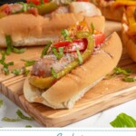 Pinterest Pin with text 'Crockpot Sausage & Peppers', image of Italian sausages in bun with peppers next to a crockpot.