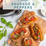 Pinterest Pin with text 'Crockpot Sausage & Peppers', image of Italian sausages in bun with peppers next to a crockpot.