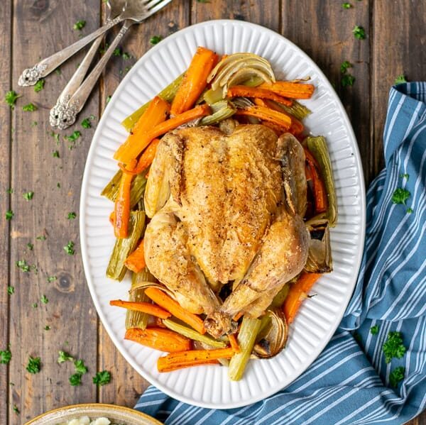 a meal with roast chicken on a table