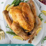 Pinterest pin with text overlay 'Easy No-Fuss Roast Turkey', image of a thanksgiving turkey on a white platter.