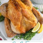 Pinterest pin with text overlay 'Easy No-Fuss Roast Turkey', image of a thanksgiving turkey on a white platter.
