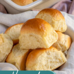 Pinterest pin with text over lay 'Homemade Dinner Rolls', image of a linen filled with a pile of soft homemade dinner rolls.