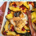 Pinterest pin with text overlay 'One Pan Autumn Chicken Dinner', image of a sheet pan with veggies and chicken thighs.