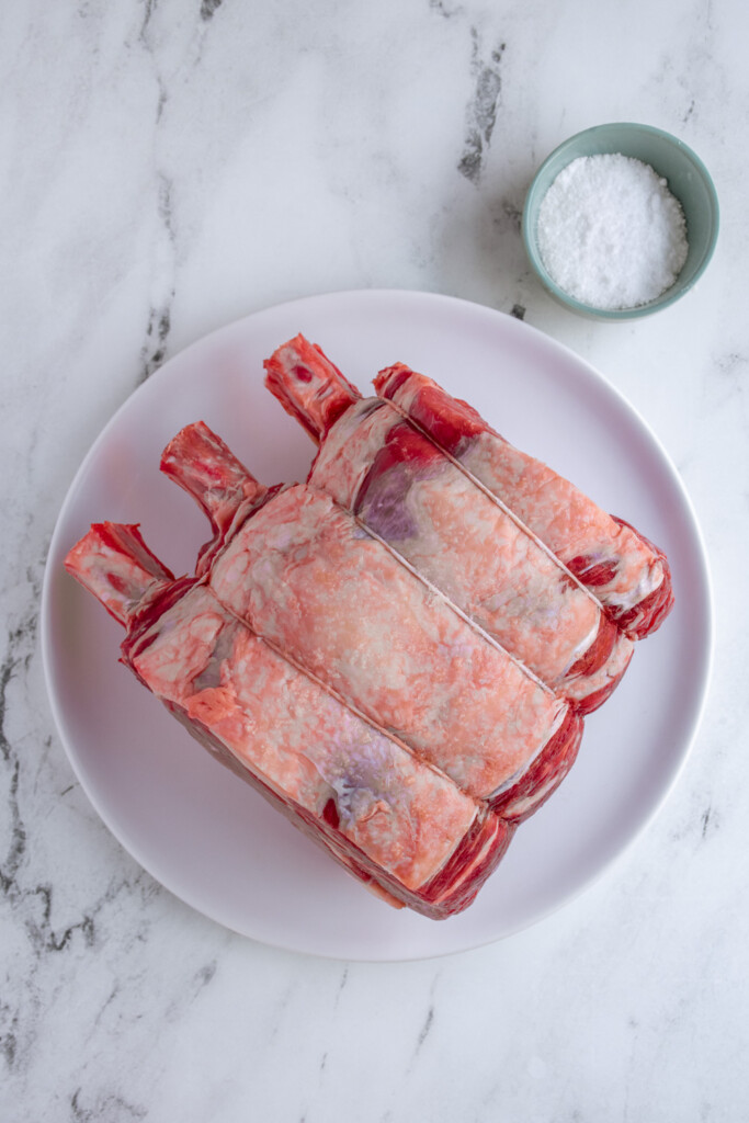 Ingredients needed to make classic prime rib laid out on the table top.