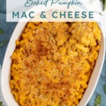 Pinterest pin with text overlay "Baked Pumpkin Mac & Cheese", image of a white casserole dish with a serving spoon scooping out Mac and cheese.