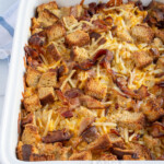 Pinterest Pin with logo 'the Schmidt wife', image of a breakfast casserole in a white dish.