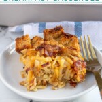Pinterest Pin with text overlay "Hash Brown & Bacon Breakfast Casserole", image of a white casserole dish with a baked breakfast casserole.