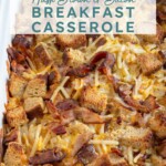 Pinterest Pin with text overlay "Hash Brown & Bacon Breakfast Casserole", image of a white casserole dish with a baked breakfast casserole.