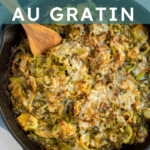 Pinterest Pin with text overlay "Brussel Sprouts Au Gratin", image of skillet filled with cheesy baked brussel sprouts.