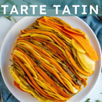 Pinterest Pin with text overlay "Root Vegetable Tarte Tatin", image showing a colorful savory tarte tatin with lines of root vegetables displayed on a plate.