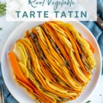 Pinterest Pin with text overlay "Root Vegetable Tarte Tatin", image showing a colorful savory tarte tatin with lines of root vegetables displayed on a plate.