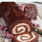 Pinterest pin with text overlay "Yule Log Cake", image of a chocolate roll up cake with whipped filling and a chocolate ganache frosting that looks like tree bark.