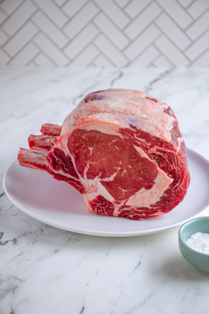 Standing Rib Roast resting on a plate.