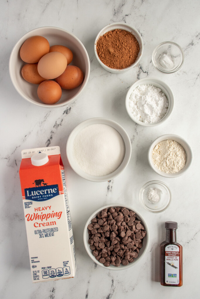 Ingredients needed to make yule log cake laid out on a tabletop.