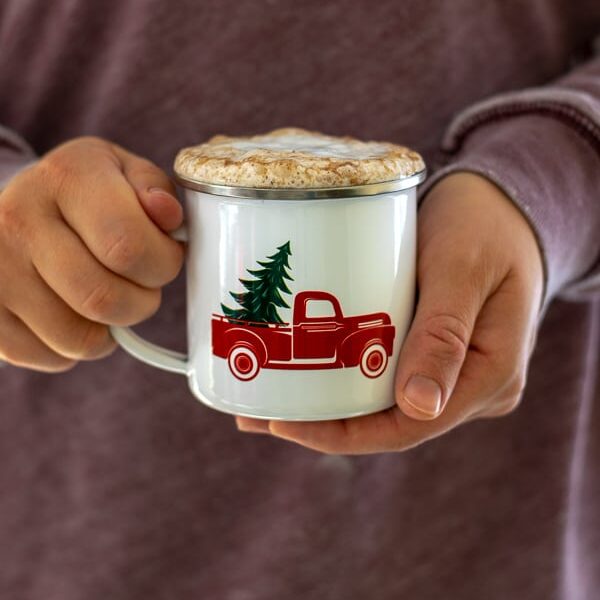 a person holding a skinny gingerbread tea latte