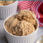 Pinterest Pin with text overlay "Gingerbread Ice Cream", image of a white bowl filled with light brown colored homemade gingerbread ice cream.