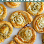 Pinterest pin with text 'Pesto Pinwheels', image of a pesto puff pastry pinwheel on a platter.
