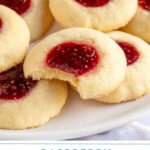 Pinterest pin with text overlay 'Raspberry Thumbprint Cookies', image of a plate of raspberry thumbprint cookies, the center one has a bite taken out.