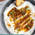 Pinterest pin with text overlay 'Whipped Feta Dip', image of a bowl with whipped feta dip and honey.
