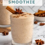 Pinterest pin with test overlay 'Banana Chai Smoothie', image of a glass filled with a light brown banana chai smoothie with garnishes.