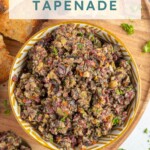 Pinterest Pin with text overlay 'Olive Tapenade', image of a yellow and white bowl filled with freshly made olive tapenade.