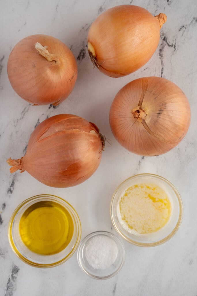 Ingredients for making crockpot onions laid out on a table top.
