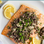 Pinterest pin with text overlay "Salmon with Olive Tapenade" with image of a plate of salmon topped with olive tapenade.