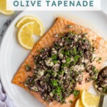 Pinterest pin with text overlay "Salmon with Olive Tapenade" with image of a plate of salmon topped with olive tapenade.