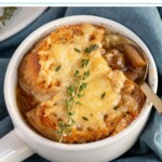 Pinterest pin with text overlay 'slow cooker French onion soup', image of a white bowl filled with French onion soup and topped with baguette and melted cheese.