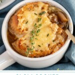Pinterest pin with text overlay 'slow cooker French onion soup', image of a white bowl filled with French onion soup and topped with baguette and melted cheese.