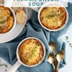 Pinterest pin with text overlay 'slow cooker French onion soup', image of a white bowl filled with French onion soup and topped with baguette and melted cheese.