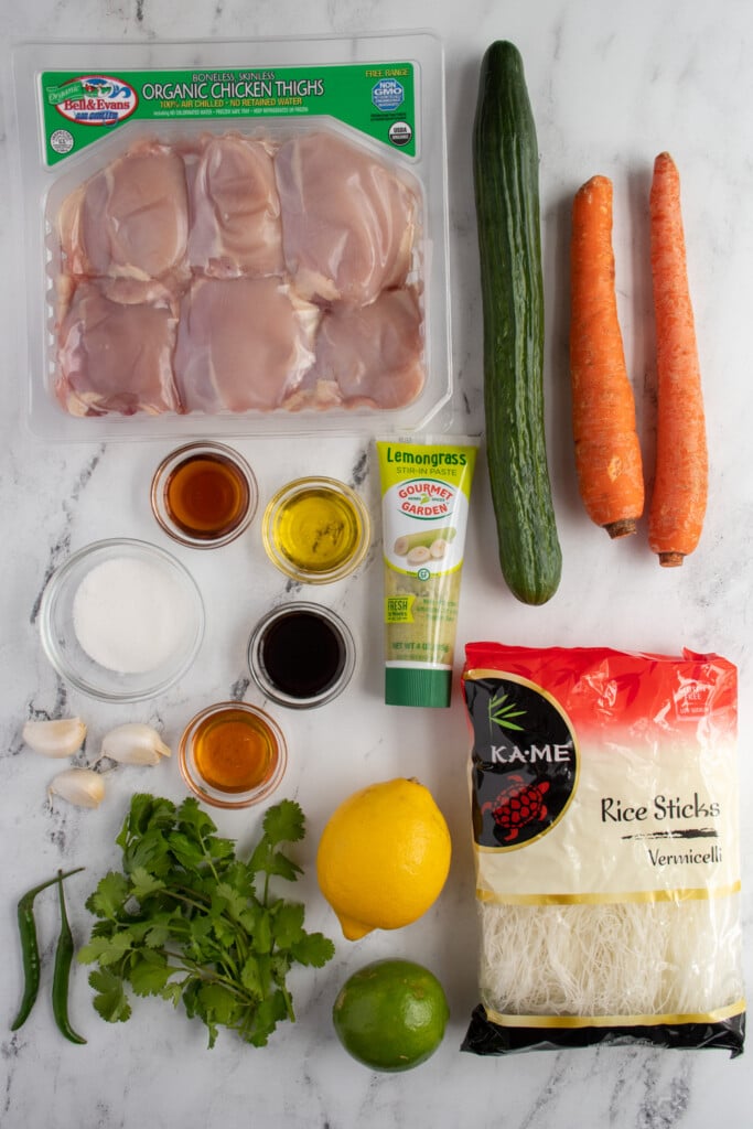 Ingredients to make lemongrass chicken with vermicelli noodles laid out on a tabletop.