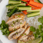 Pinterest pin with logo 'the schmidty wife', image of a white bowl filled with vermicelli noodles, lemongrass chicken, vegetables, and nuoc cham.