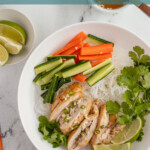 Pinterest pin with text overlay "Vietnamese Lemongrass Chicken Vermicelli Bowls", image of a white bowl filled with vermicelli noodles, lemongrass chicken, vegetables, and nuoc cham.