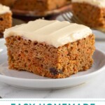 Pinterest pin with text overlay "Easy Homemade Carrot Cake", image of a slice of orange spiced carrot cake with cream cheese frosting on a plate.
