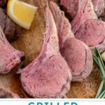 Pinterest pin with text overlay 'Grilled Rack of Lamb', image of rack of lamb cut into pieces and waiting to be served on a wood cutting board.