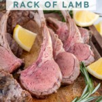Pinterest pin with text overlay 'Grilled Rack of Lamb', image of rack of lamb cut into pieces and waiting to be served on a wood cutting board.