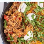 Pinterest pin with text overlay "Taco Rice Skillet" with image of taco rice skillet made in a cast iron.