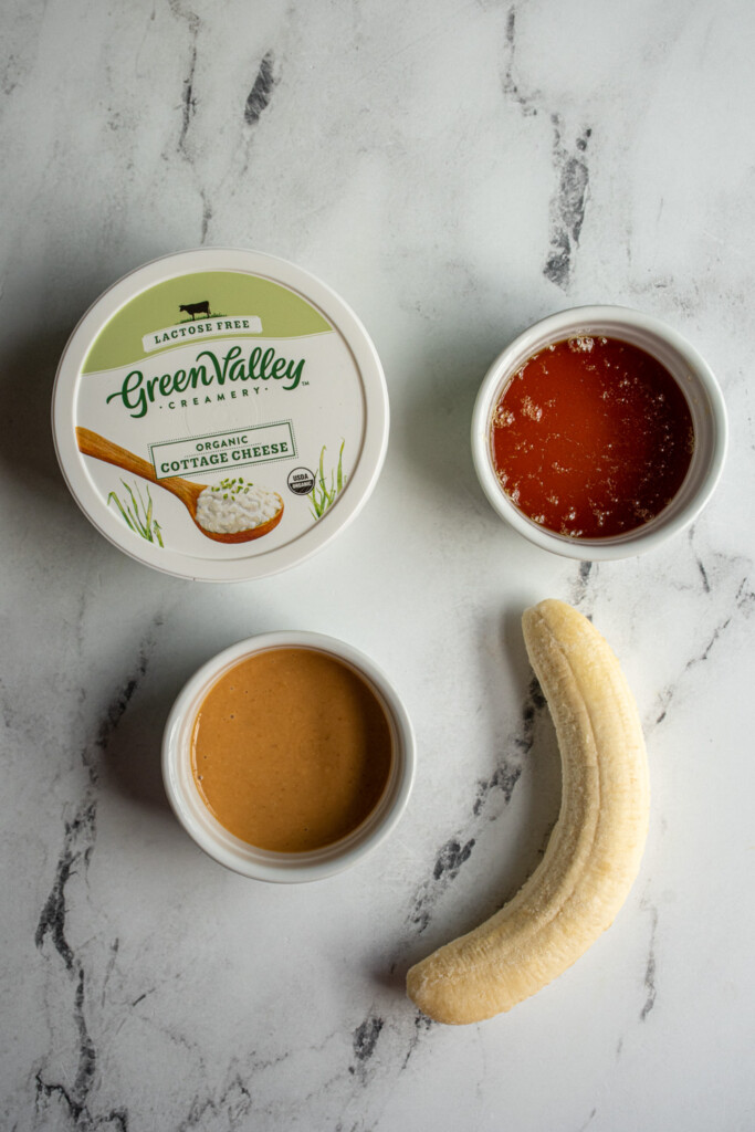 Ingredients needed for making banana cottage cheese ice cream with peanut butter swirls.