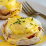Pinterest pin with logo overlay "The Schmidty Wife", image of eggs Benedict on a white plate.