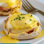 Pinterest pin with text overlay "Easy Eggs Benedict", image of eggs Benedict on a white plate.